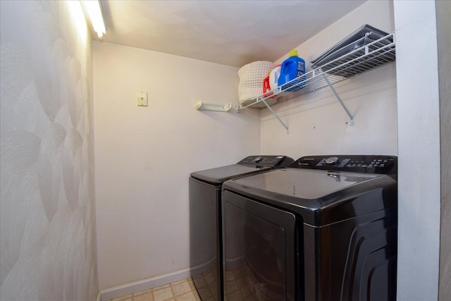 clothes washing area with washer and dryer