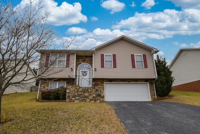 bi-level home with a garage and a front yard