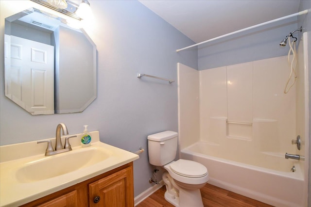 full bathroom featuring vanity, hardwood / wood-style floors, shower / tub combination, and toilet