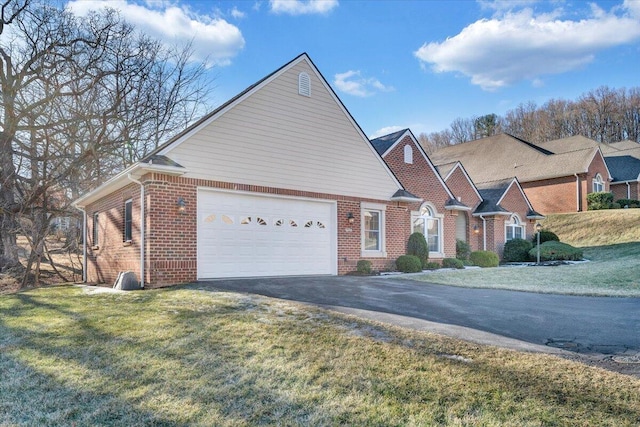 view of front of house with a garage and a front yard