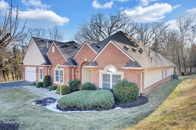 view of front of home featuring a garage and a front yard