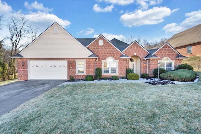 view of front of home featuring a garage and a front yard