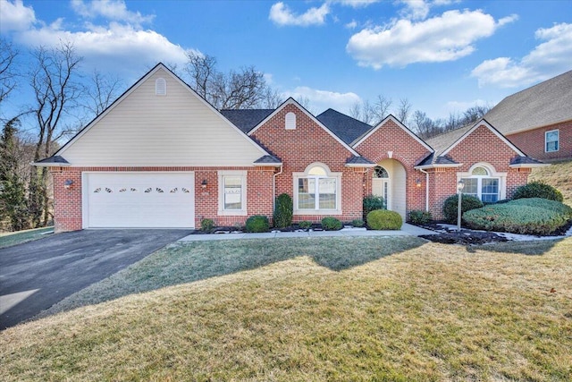 view of front of property featuring a garage and a front lawn