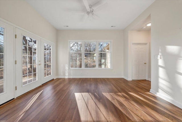 interior space with dark wood-type flooring, ceiling fan, and french doors