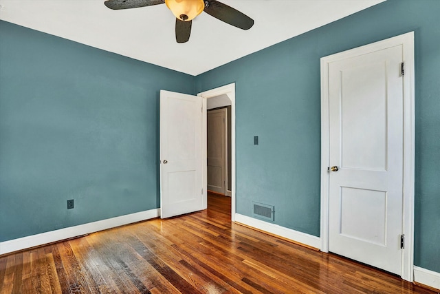 unfurnished bedroom with hardwood / wood-style floors and ceiling fan