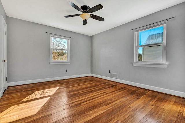 empty room featuring hardwood / wood-style floors and ceiling fan