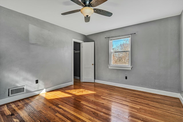 spare room featuring hardwood / wood-style flooring and ceiling fan