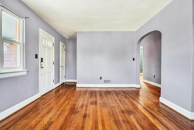 entryway with dark hardwood / wood-style floors