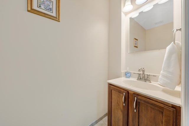 bathroom with tile patterned floors and vanity