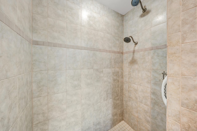 bathroom with tiled shower