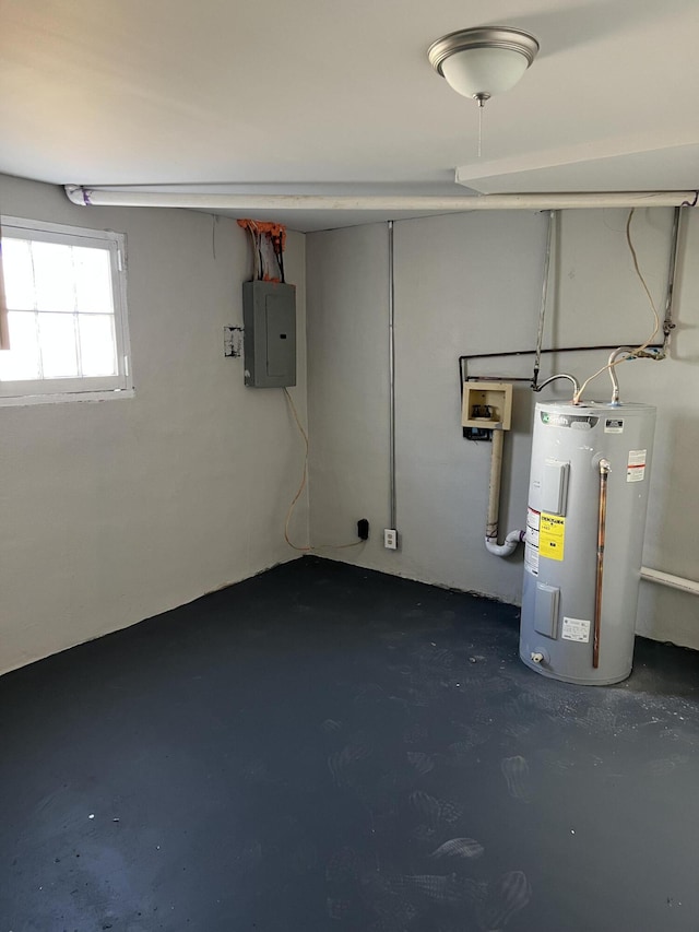 basement featuring electric panel and water heater