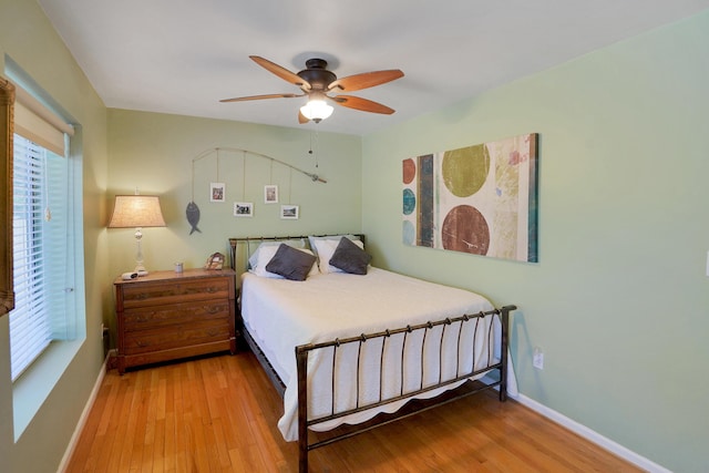 bedroom featuring hardwood / wood-style flooring and ceiling fan