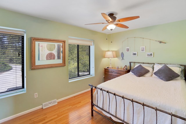 bedroom featuring hardwood / wood-style floors and ceiling fan