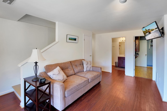 living room featuring dark wood-type flooring