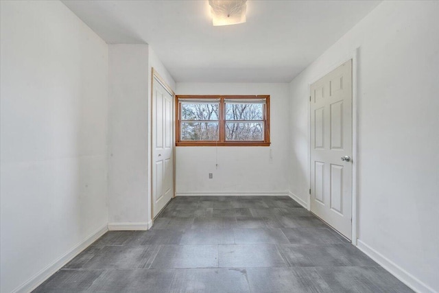 unfurnished bedroom featuring baseboards