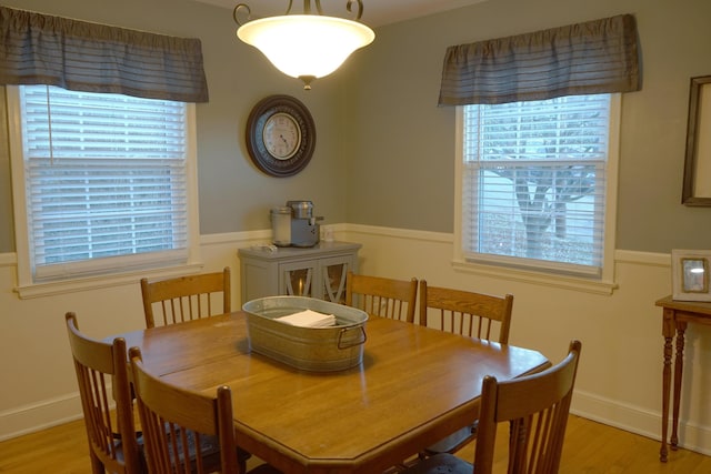 dining space featuring light wood-type flooring