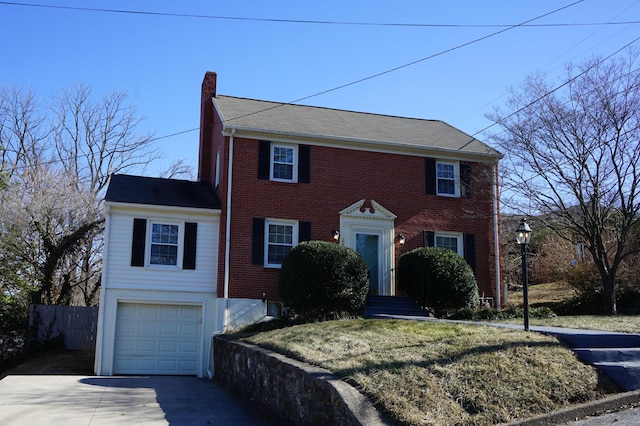 colonial-style house featuring a garage