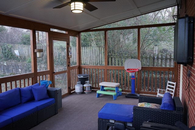 sunroom / solarium with lofted ceiling and ceiling fan