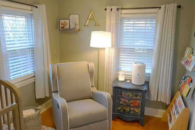 living area with hardwood / wood-style floors