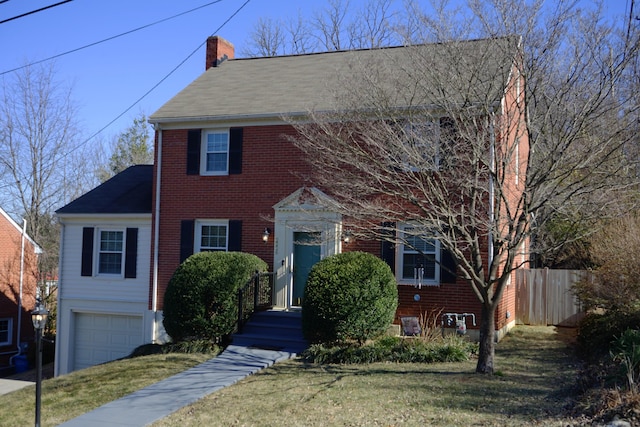 view of front facade featuring a garage and a front lawn