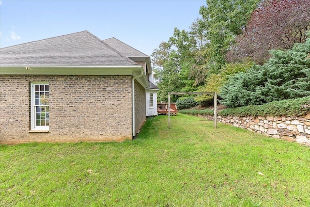 view of yard featuring a wooden deck