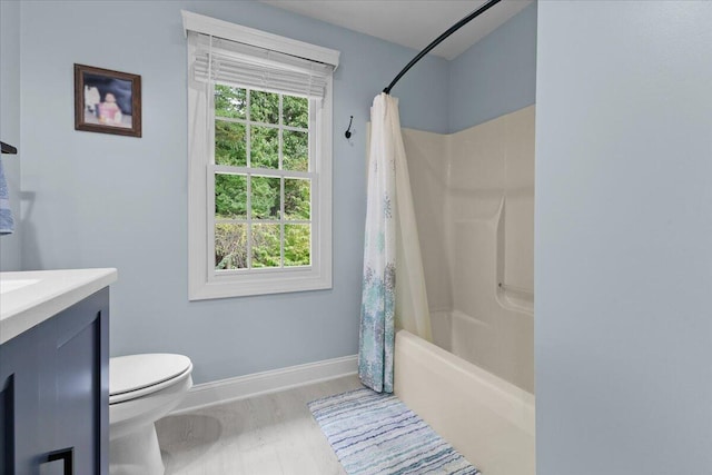 full bathroom featuring shower / bathtub combination with curtain, vanity, hardwood / wood-style flooring, and toilet