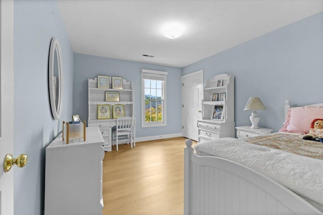 bedroom with light hardwood / wood-style flooring