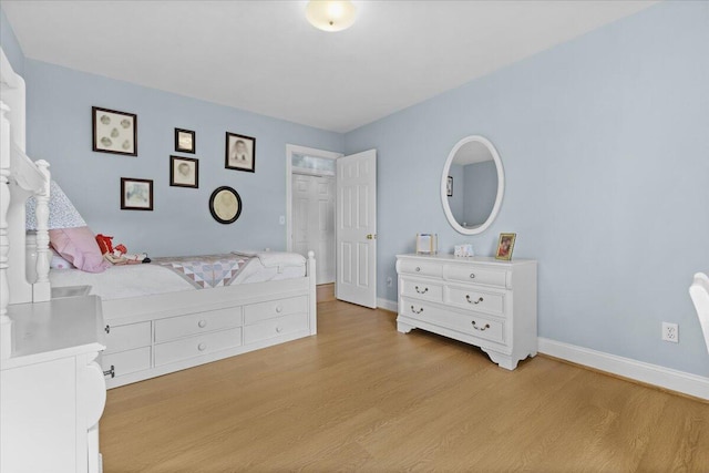 bedroom with light hardwood / wood-style flooring