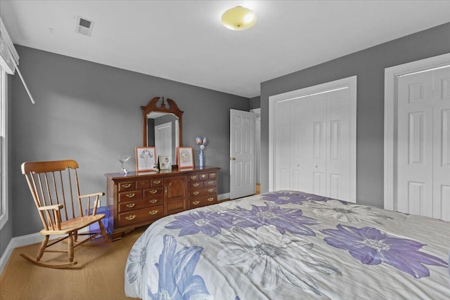 bedroom with hardwood / wood-style flooring and a closet