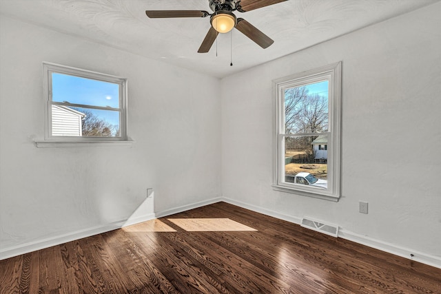 spare room with wood-type flooring and ceiling fan