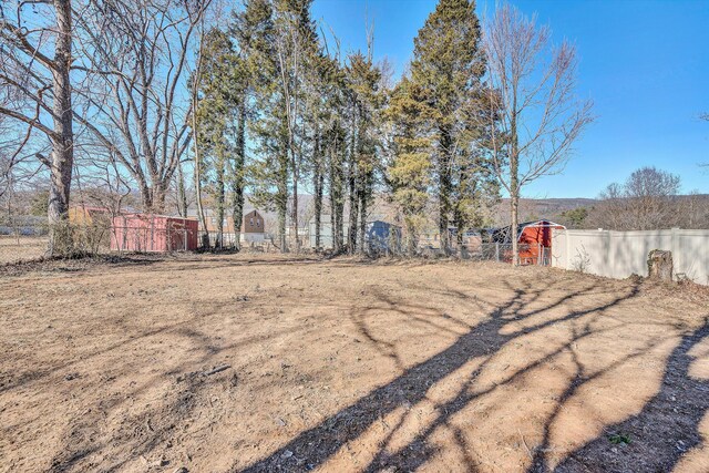 view of yard with a storage unit