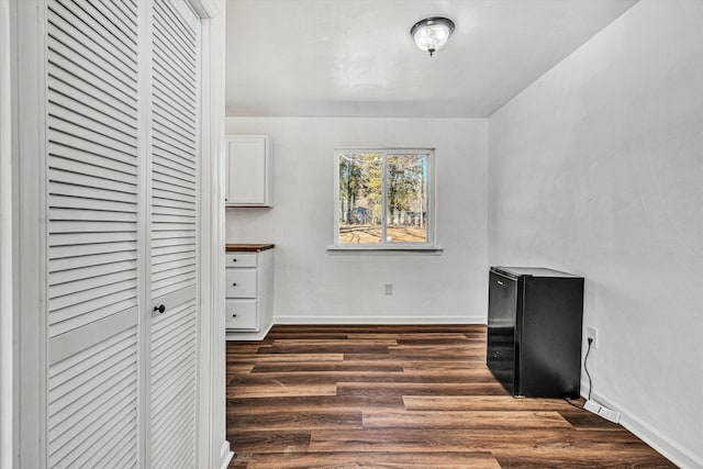 office area featuring dark wood-type flooring