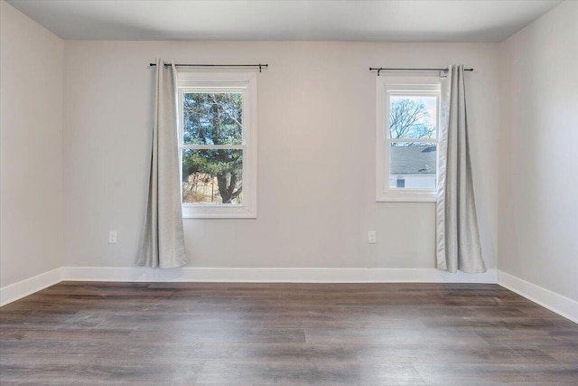 empty room featuring dark wood-type flooring