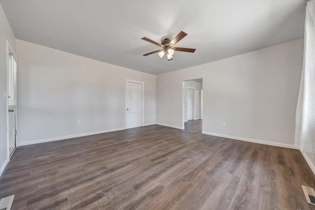 unfurnished room featuring ceiling fan and dark hardwood / wood-style flooring