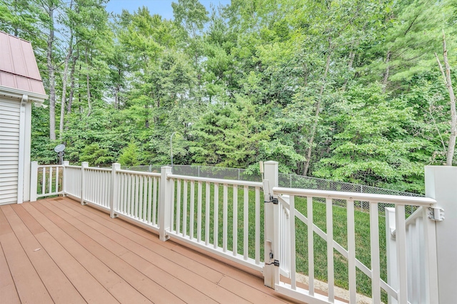 wooden terrace with a lawn