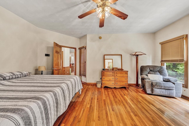 bedroom with hardwood / wood-style floors and ceiling fan