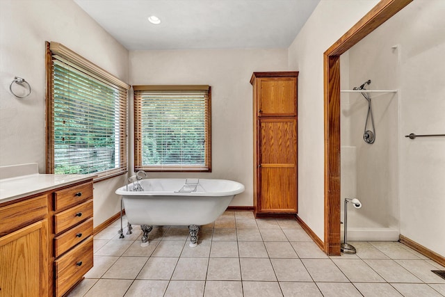 bathroom featuring tile patterned flooring, plus walk in shower, and vanity