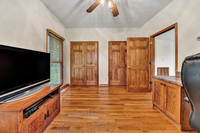 interior space with ceiling fan and light wood-type flooring