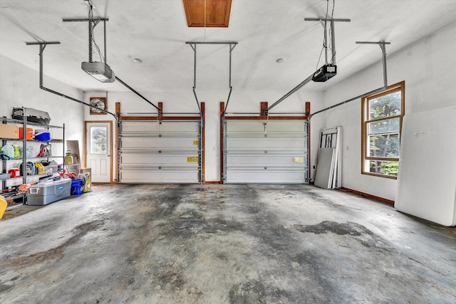 garage featuring a garage door opener and white fridge