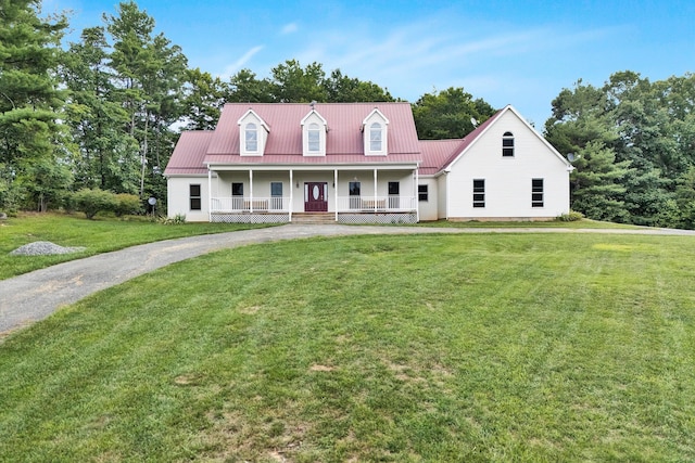 view of front of house featuring a front lawn and covered porch