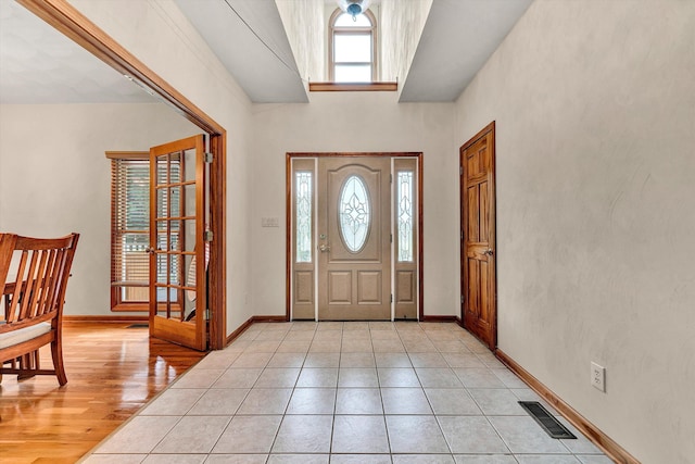 entrance foyer with a wealth of natural light and light tile patterned floors