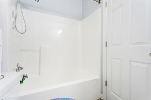 bathroom with bathing tub / shower combination