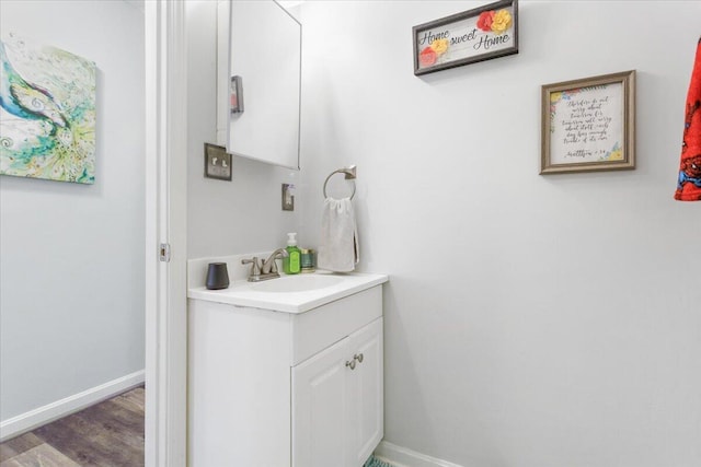 bathroom featuring hardwood / wood-style flooring and vanity