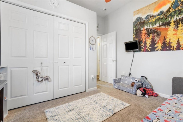 carpeted bedroom featuring a closet