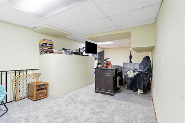 carpeted office with a drop ceiling