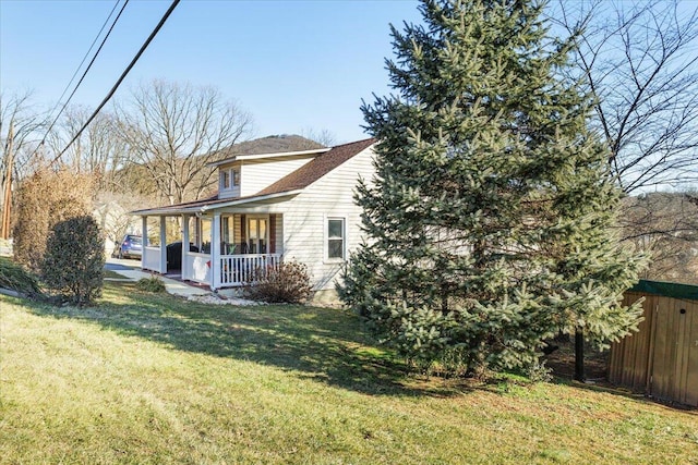 exterior space featuring a yard and a porch