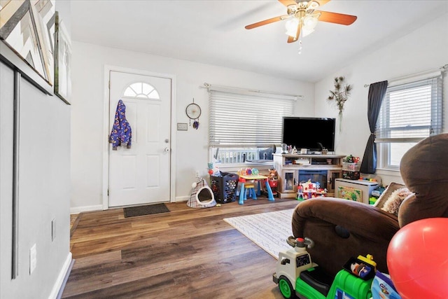 interior space featuring hardwood / wood-style flooring, ceiling fan, and lofted ceiling