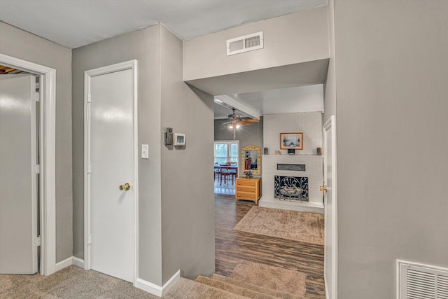 hallway with hardwood / wood-style flooring