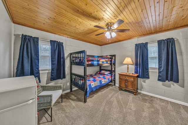 carpeted bedroom with wood ceiling and ceiling fan