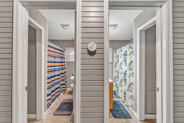 bathroom featuring tile patterned floors and toilet